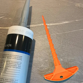 Sklenený tmelový uzáver a čistič trysky k pištoli na tmel, vhodné pre trubky s bežným priemerom