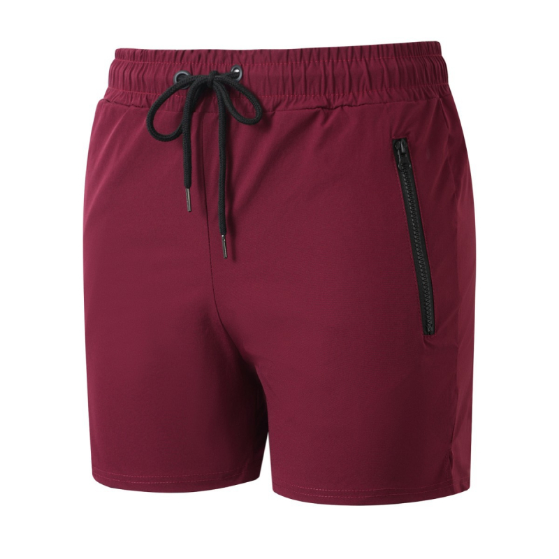 Pánske rýchloschnúce šortky – voľný strih, stredný pás, priedušné zloženie 90% nylon, vhodné na beh a fitness