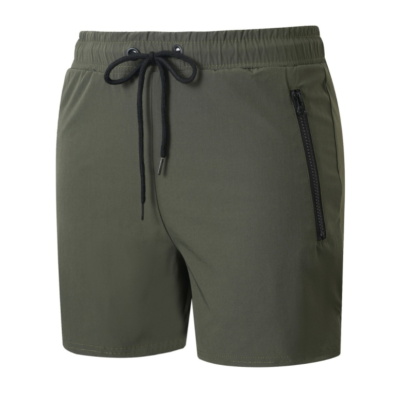 Pánske rýchloschnúce šortky – voľný strih, stredný pás, priedušné zloženie 90% nylon, vhodné na beh a fitness