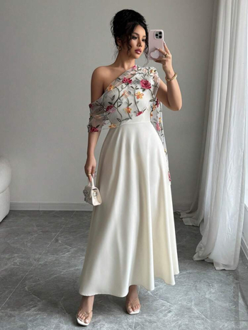 V-nyakú, ujj nélküli ruha hálós hímzéssel, nagy sziluett, közepes hosszúságú ruha, poliészter anyag.