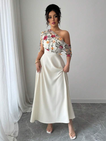 V-nyakú, ujj nélküli ruha hálós hímzéssel, nagy sziluett, közepes hosszúságú ruha, poliészter anyag.