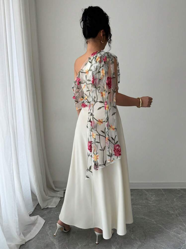 V-nyakú, ujj nélküli ruha hálós hímzéssel, nagy sziluett, közepes hosszúságú ruha, poliészter anyag.