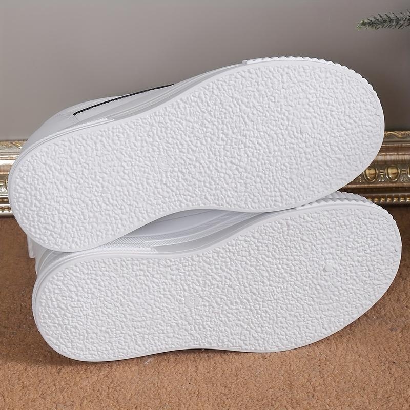 Raffia felsőrészes tornacipő, csíkos mintázat, gyapjú bélés, hintázó talp, sarokmagasság 0–1 cm