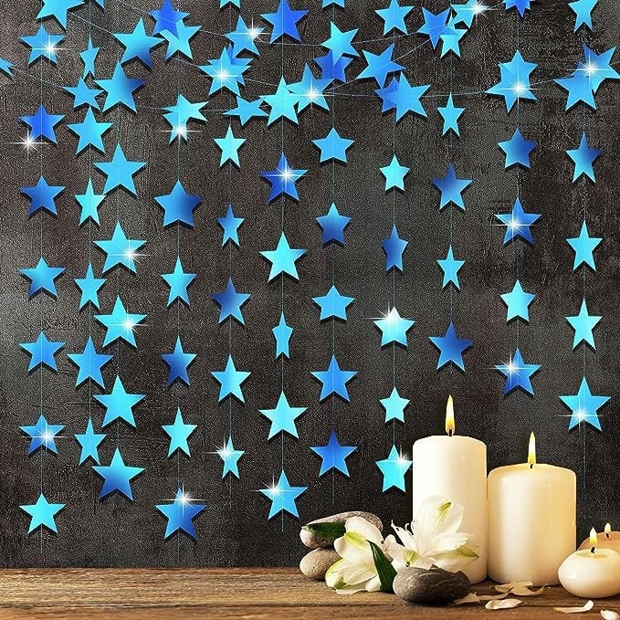 Prívesok s páskou do výzdoby miesta – päťcípová hviezda, papier a stuhy; vhodné pre domovú výzdobu a festivalové darčeky.