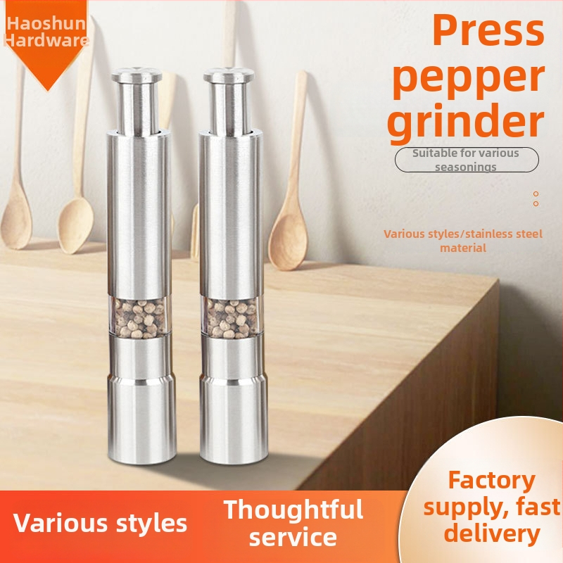 Mlynček na korenie, ručný tlačný typ, nerezová oceľ, vhodný pre pevné koreniny, logo tlačené