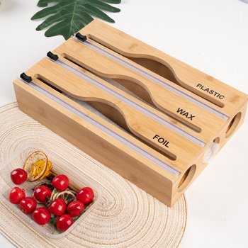 Bambusový nástenný dávkovač fólie s dvojstranným rezom; možnosť vlastného loga a prispôsobenia.