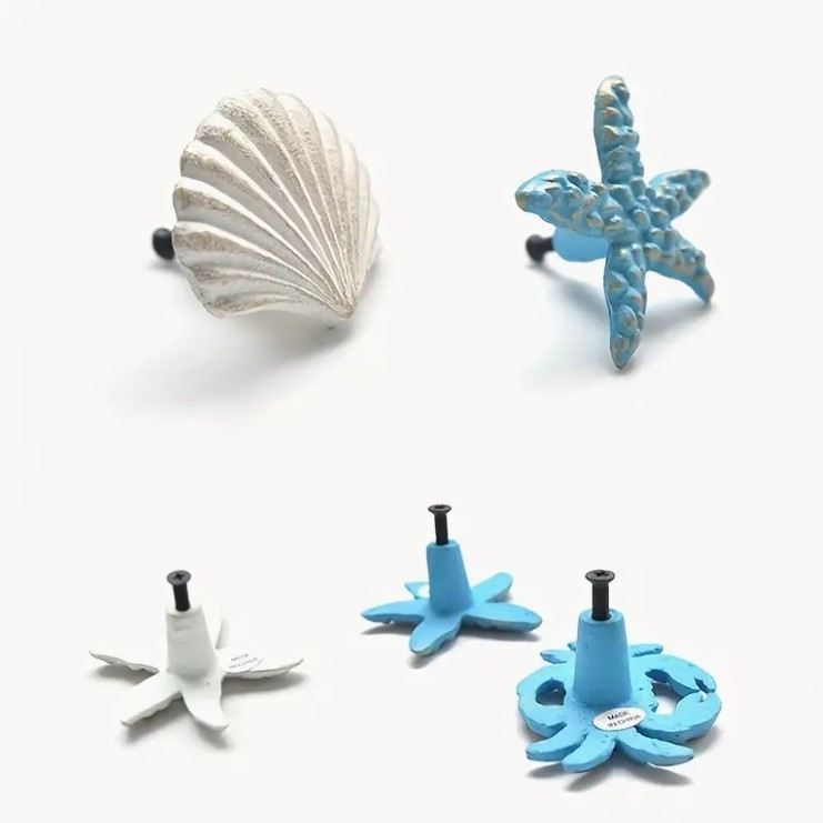 Litinová úchytka na skriňu s motívom morskej hviezdy, s jedným otvorom, moderný minimalistický štýl (Materiál: litina; Štýl: moderný minimalizmus; Motív: morská hviezda; Použitie: skrine)