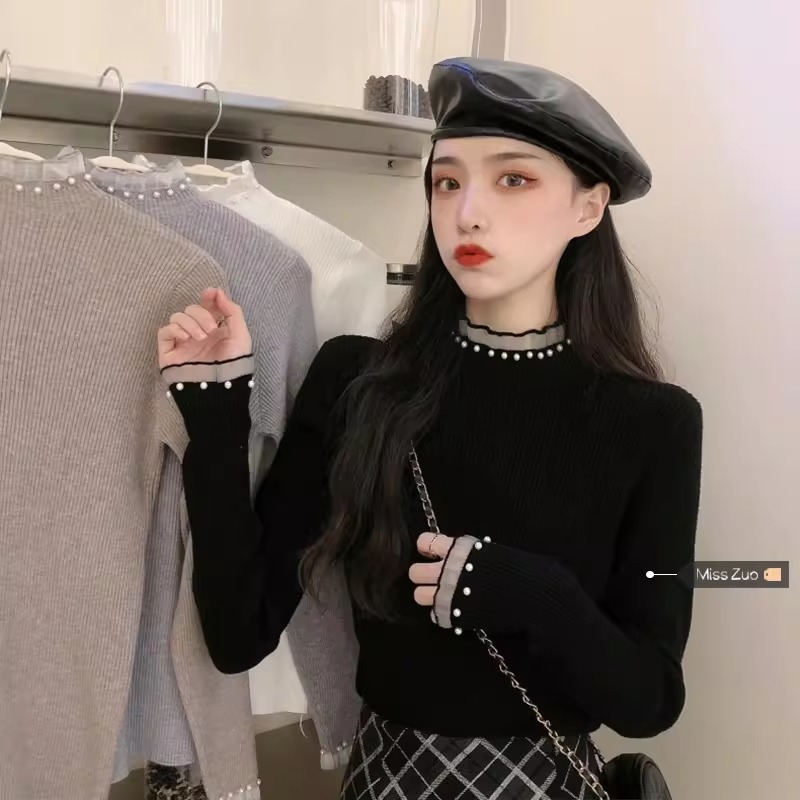 Viskoosist kudumispull poolkõrge kaelusega, slim lõige, pikad varrukad, ühtlane muster