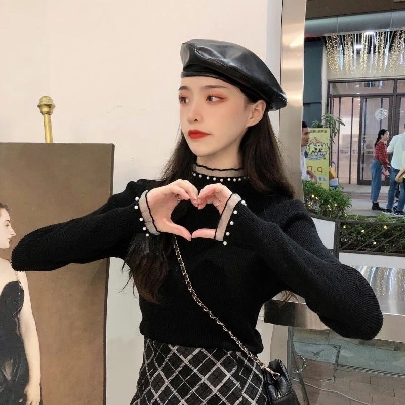 Viskoosist kudumispull poolkõrge kaelusega, slim lõige, pikad varrukad, ühtlane muster