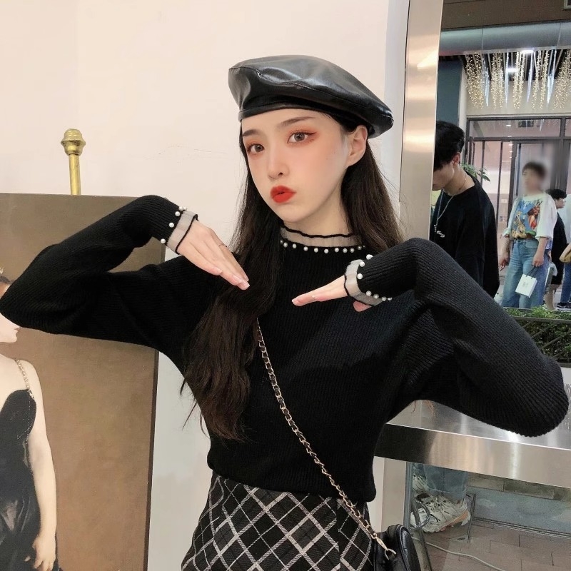 Viskoosist kudumispull poolkõrge kaelusega, slim lõige, pikad varrukad, ühtlane muster