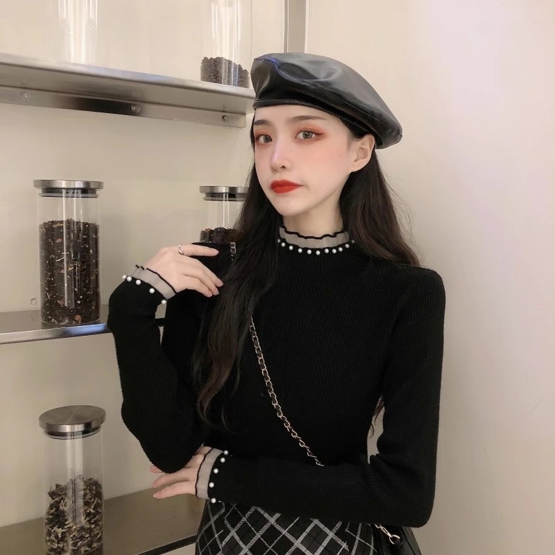 Viskoosist kudumispull poolkõrge kaelusega, slim lõige, pikad varrukad, ühtlane muster