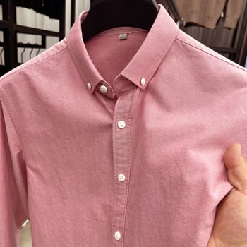 Muška bijela oxford košulja s dugim rukavima, elegantna i ležerna za proljeće