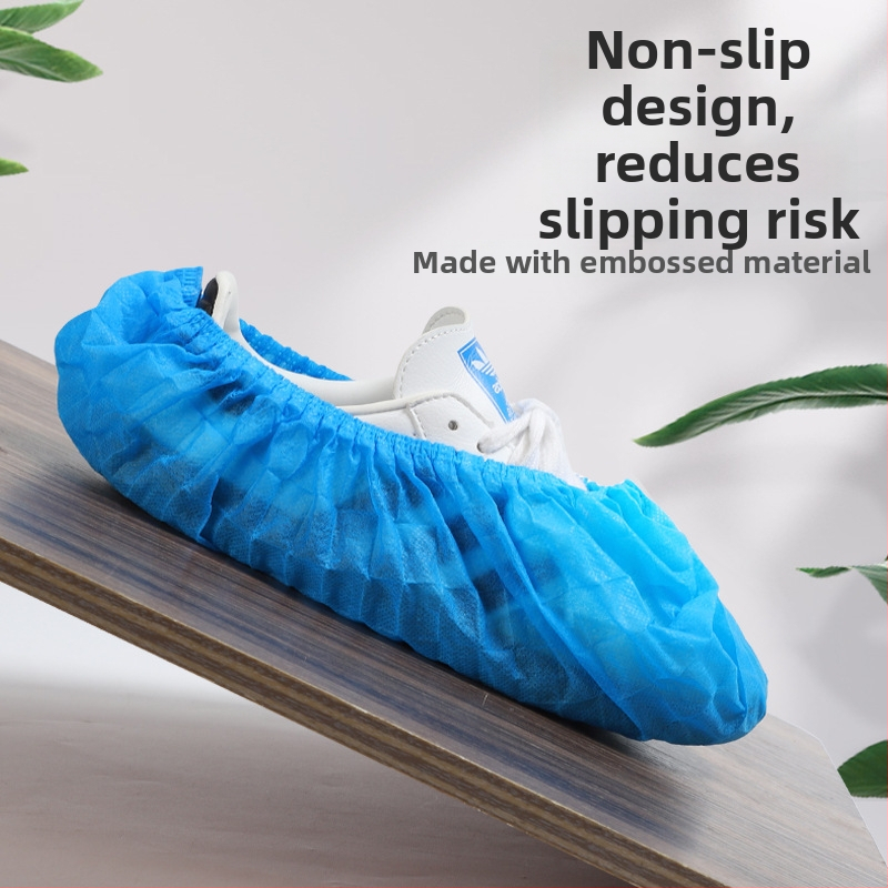 Vienreizējās neausto materiāla kurpju pārklāji, bieza, elpojoši, pretslīdēšanas, pret putekļiem mājas lietošanai; 300 g biezums; 100 gab./iepakojums