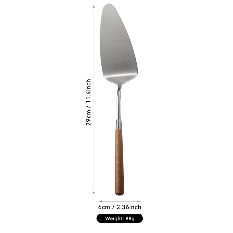 304 nerezovej ocele západné jedlá s orechovým držadlom, leštený povrch. Obsahuje: nôž, vidlica, lyžica, lopatka na tortu, nô na chlieb, motýľová lopatka, malá lyžička