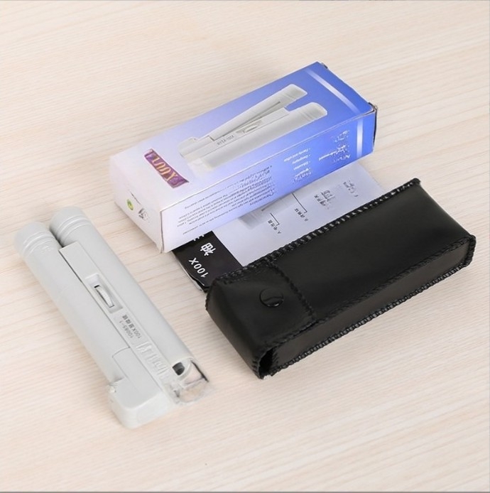 Käsihoidlik LED-mikroskoop 100x topelttoru disainiga juveelide, portselani, antiikesemete, müntide ja postmärkide identifikatsiooniks