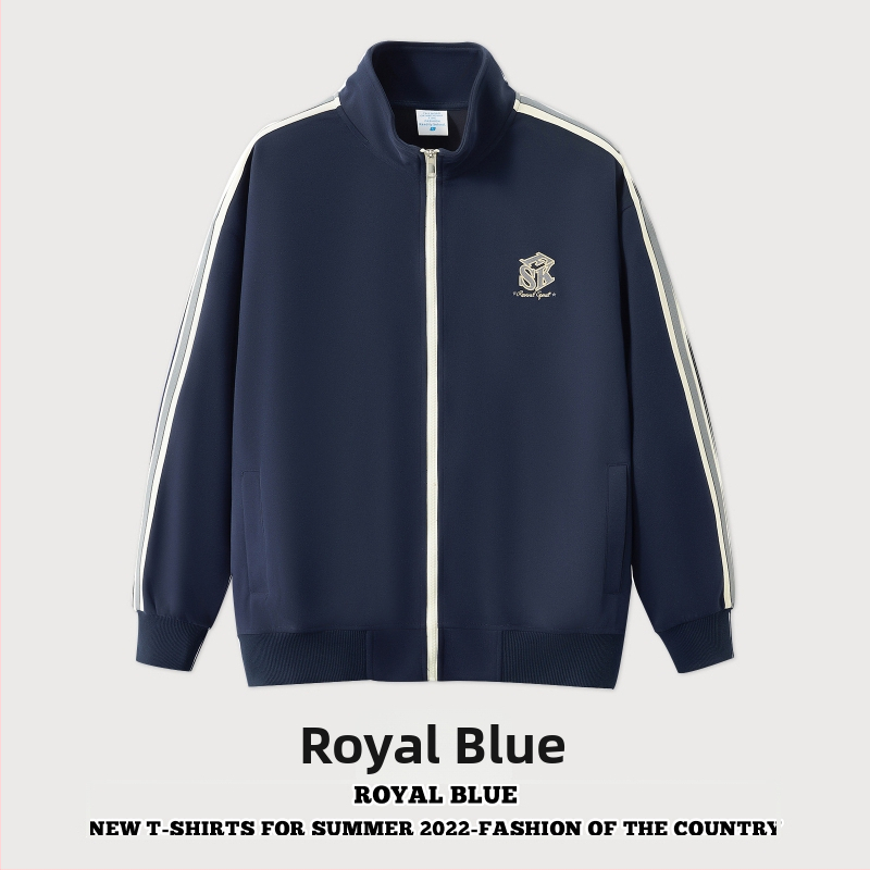 Õhku läbilaskev puuvillane jak, tõmblukuga, püstise kaelaga, vaba lõige ja pikkade varrukatega.