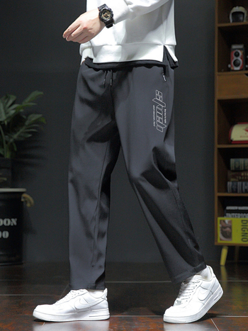 Pánske voľné športové nohavice, ľahký polyester s elastanom, stredný pás, šnúrka na stiahnutie, potlač s písmenami, leto