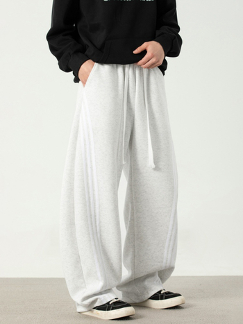 Texturované voľno strihané športové nohavice s bočnými pruhmi, voľné, stredný pás, šnúrkové zapínanie, zmes bavlny a polyesteru