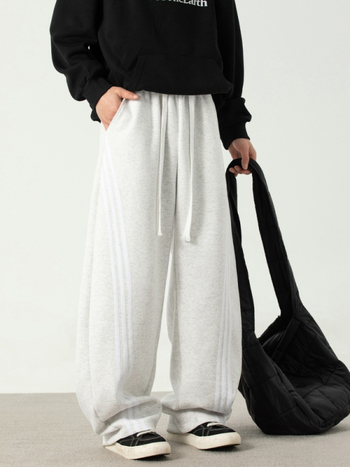 Texturované voľno strihané športové nohavice s bočnými pruhmi, voľné, stredný pás, šnúrkové zapínanie, zmes bavlny a polyesteru