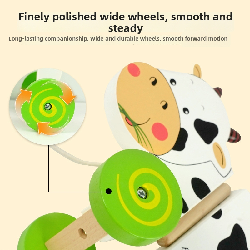Koka vilcējam ratiem ar piena govs motīvu, bērniem 4–6 gadiem — izglītojoša agrīnas attīstības rotaļlieta