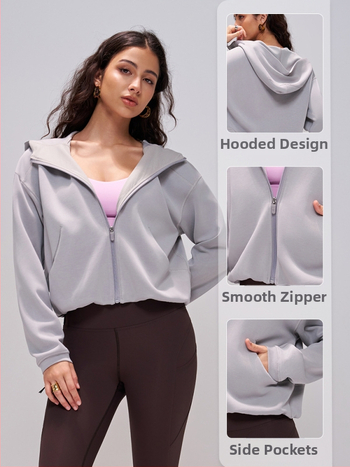 Moteriški su kapuču sportinis viršus pavasario–rudens, joga, ilgomis rankovėmis, užtrauktukas, be pamušalo, modalinis-sintetinis audinys (40% modal, 52% poliesteris, 8% spandeksas)