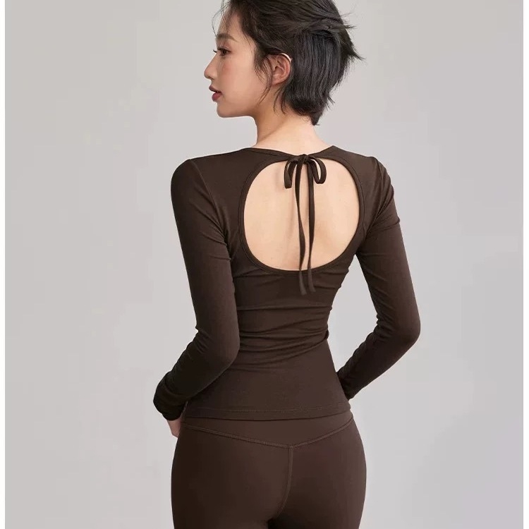 Joga viršūnė su atvira nugara ir virvelinėmis petnešomis, su krūtinės pagalvėle, kvėpuojantis Nailono-Spandekso pluoštas, ilgomis rankovėmis, įprastas ilgis