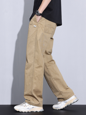 Plašas kokvilnas bikses ar vidējo jostas vietu, taisnais griezums, rāvējslēdzējs priekšā