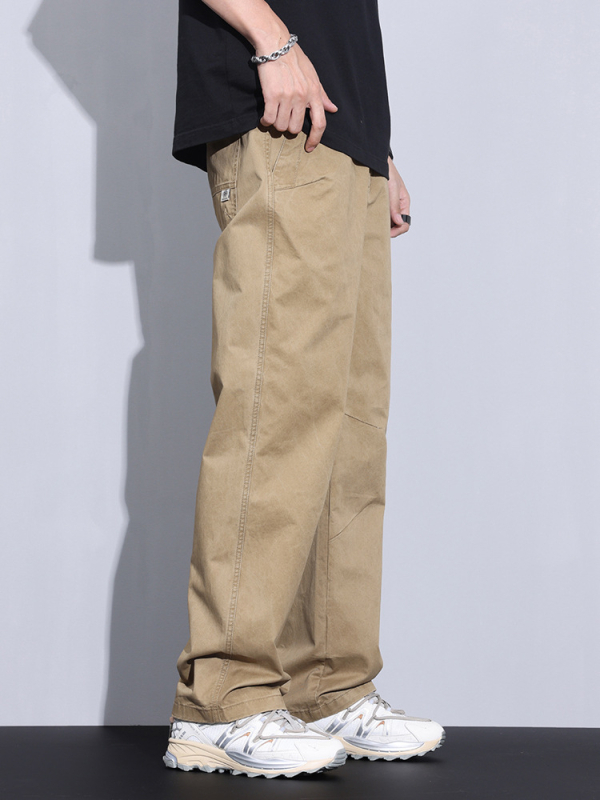 Plašas kokvilnas bikses ar vidējo jostas vietu, taisnais griezums, rāvējslēdzējs priekšā