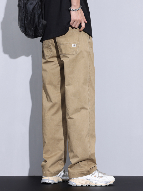 Plašas kokvilnas bikses ar vidējo jostas vietu, taisnais griezums, rāvējslēdzējs priekšā