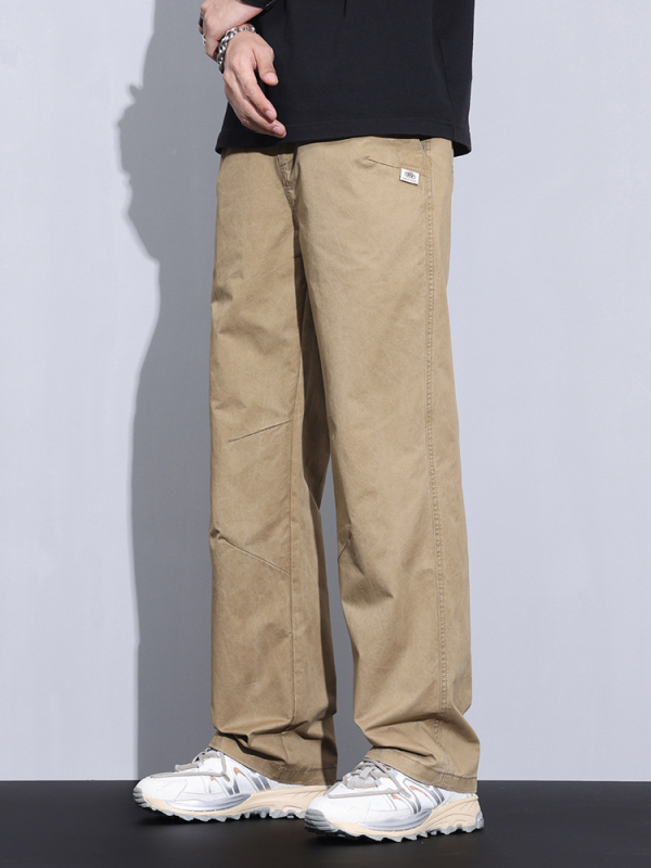 Plašas kokvilnas bikses ar vidējo jostas vietu, taisnais griezums, rāvējslēdzējs priekšā