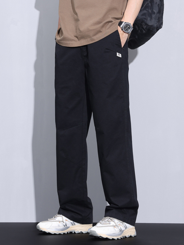 Plašas kokvilnas bikses ar vidējo jostas vietu, taisnais griezums, rāvējslēdzējs priekšā