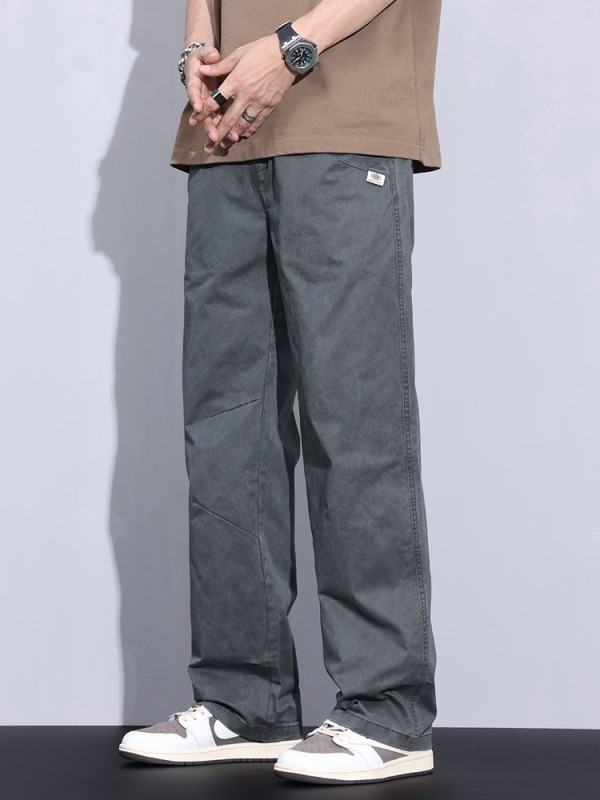 Plašas kokvilnas bikses ar vidējo jostas vietu, taisnais griezums, rāvējslēdzējs priekšā