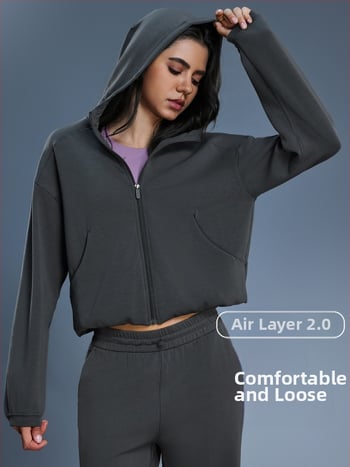 Női kapucnis cipzáros pulóver, lazán szabott, futáshoz és edzéshez, őszi-téli szezon; pamutkeverék anyag 52% poliészter; belső bélés pamut.