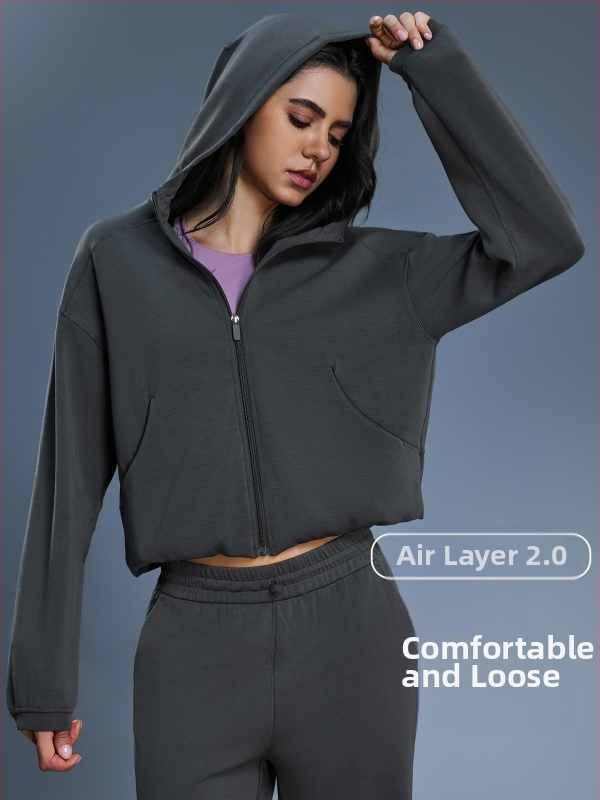 Naiste kapuutsiga tõmblukuga dressipluus, vaba lõikega, sobib jooksmiseks ja fitnessiks, sügis-talvise hooajale; puuvillasegu kangas (52% polüester); vooder puuvill.