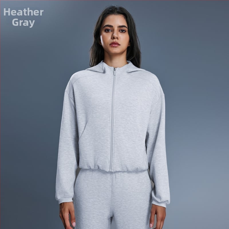 Női kapucnis cipzáros pulóver, lazán szabott, futáshoz és edzéshez, őszi-téli szezon; pamutkeverék anyag 52% poliészter; belső bélés pamut.