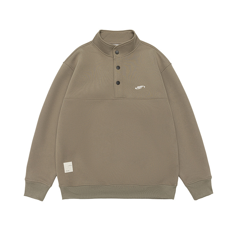 Meleg fleece pulóver felső álló gallérral, előröl gombos záródás, laza szabás, hímzett applikációkkal