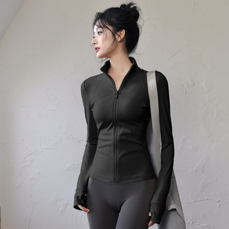 Ženski top za jogu i fitness – uski kroj, dugi rukavi, brzo sušeći materijal; tkanina: mješavina kemijskih vlakana, sastav tkanine: 82,5% poliester; podstava: Spandex, sadržaj podstave: poliester