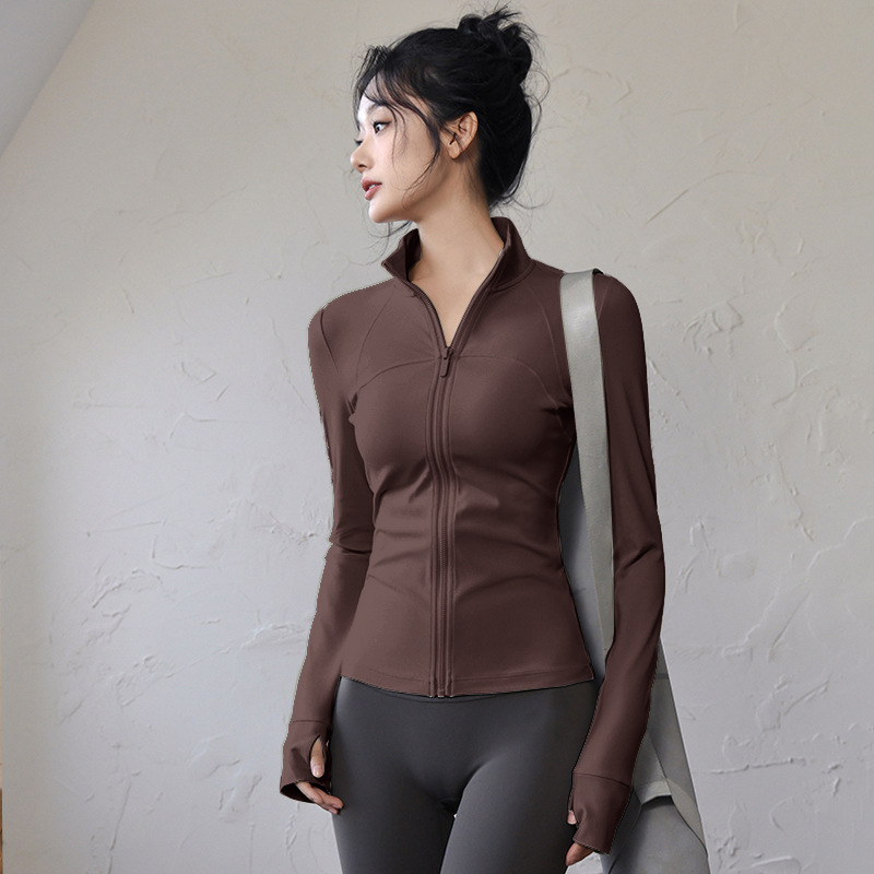 Ženski top za jogu i fitness – uski kroj, dugi rukavi, brzo sušeći materijal; tkanina: mješavina kemijskih vlakana, sastav tkanine: 82,5% poliester; podstava: Spandex, sadržaj podstave: poliester