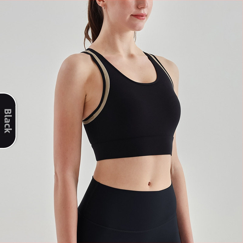 Sportinė liemenėlė; push-up ir atsparus smūgiams; 3/4 puodeliai; vidutinio puodelio forma; pagrindinė medžiaga 75% nailonas, pamušalas 25% spandeks