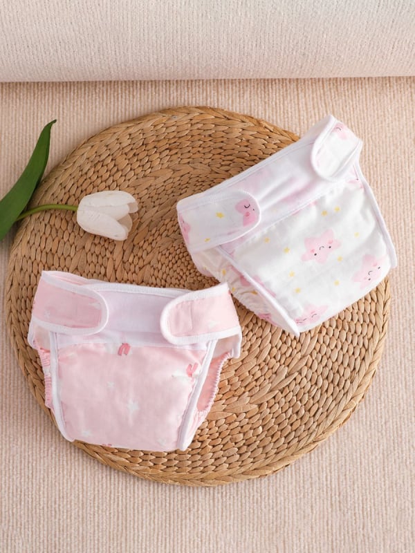 Vaikų treniravimo kelnaitės kategorija A – vandeniui atspari marle, skalbiasi, šoninio nuotėkio apsauga, amžiaus grupė 0–6 mėn, 6–12 mėn, 1–3 m; tinka 15 kg+