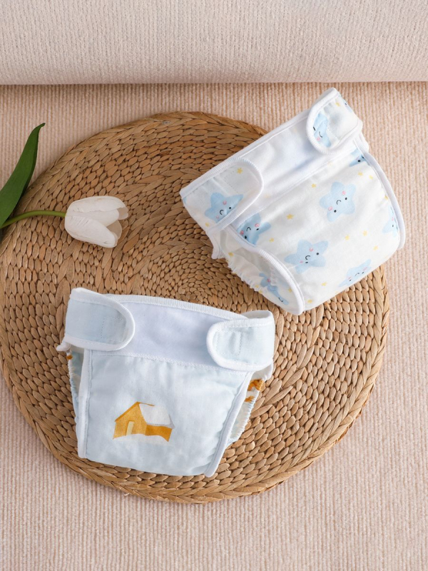 Vaikų treniravimo kelnaitės kategorija A – vandeniui atspari marle, skalbiasi, šoninio nuotėkio apsauga, amžiaus grupė 0–6 mėn, 6–12 mėn, 1–3 m; tinka 15 kg+