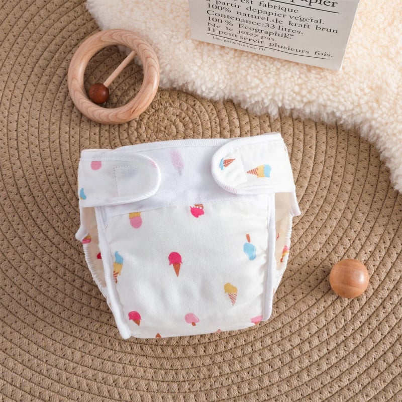 Vaikų treniravimo kelnaitės kategorija A – vandeniui atspari marle, skalbiasi, šoninio nuotėkio apsauga, amžiaus grupė 0–6 mėn, 6–12 mėn, 1–3 m; tinka 15 kg+