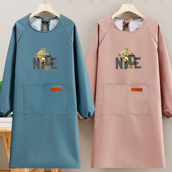 Suaugusiųjų prijuostė, atspari vandeniui, kompozitinė medžiaga, šiuolaikiškas minimalistinis stilius, karikatūrų raštas