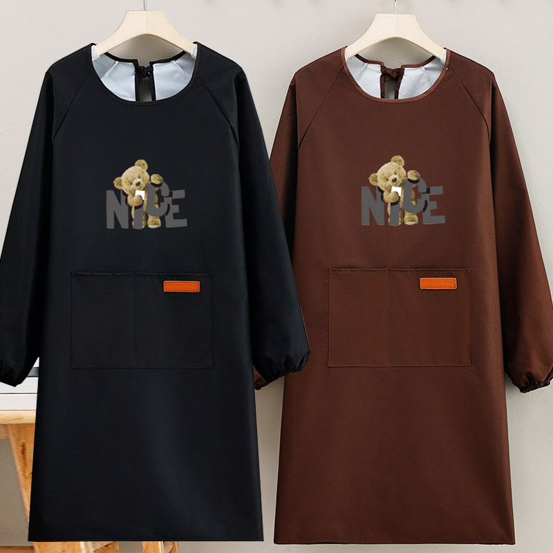 Suaugusiųjų prijuostė, atspari vandeniui, kompozitinė medžiaga, šiuolaikiškas minimalistinis stilius, karikatūrų raštas