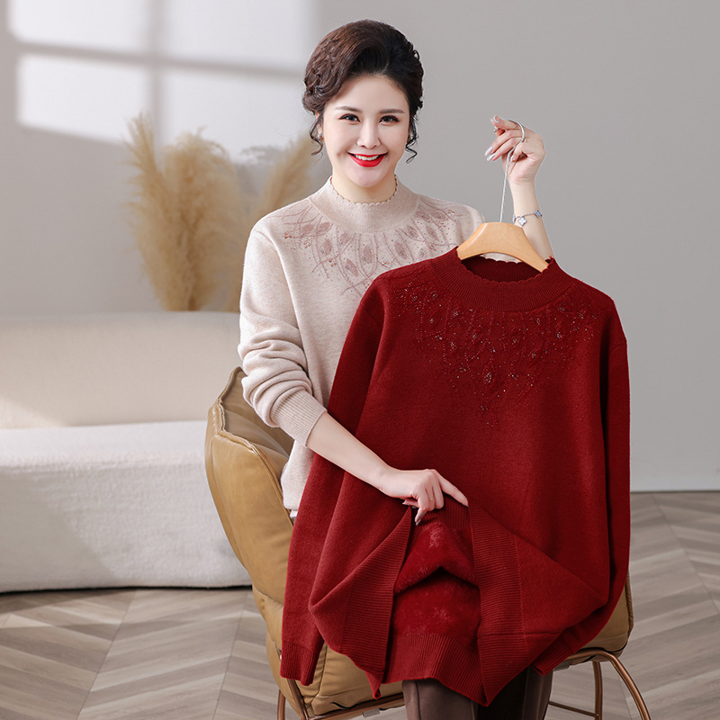 Női téli fleeces pulóver laza szabású, hosszú ujjú, fél magas gallér, középhosszú, hímzés; TR anyag, PVC <=30%, poliészter <=30%