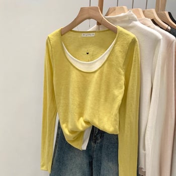 Πλεκτό τοπ με αντίθεση χρωμάτων και patchwork σχέδιο, στρογγυλός λαιμός, μακριά μανίκια, φαρδιά γραμμή, πολυεστέρας 90–95%.