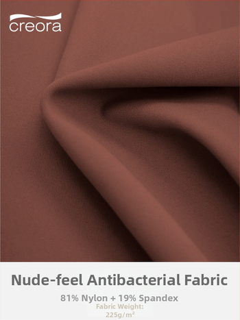 Antibakterinis nude jausmo jogos viršelis su krūtinės pagalvėle, sportinis liemenėlis su šoko atspariu dizainu aukštos intensyvumo treniruotėms; 3/4 puodeliai, ploni formuoti puodeliai, fiksuoti petnešos; pagrindinis audinys: nailonas 81%, pamušalas: spand