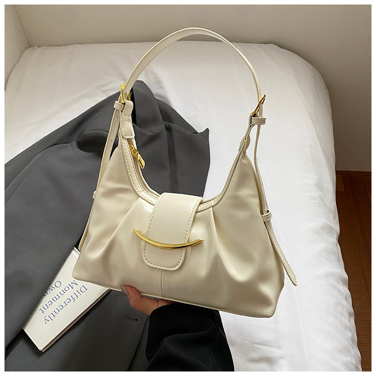 Kaenlaalune kott linna minimalistliku stiiliga, PU materjalist, horisontaalne ristkülikukujuline kuju, tõmblukk, üks rihm