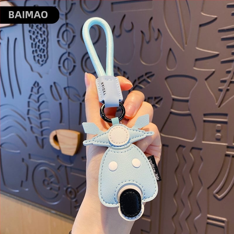 Ādas karikatūru atslēgu piekariņš ar transportlīdzekļu motīviem – automašīna, lidmašīna un autobuss