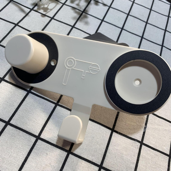 Nástenný držiak na sušič vlasov s magnetickým uchytením, bez vŕtania; model CD02; nosnosť 5 kg; štýl moderný minimalistický